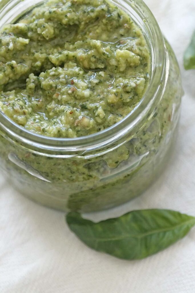 homemade basil pesto in a glass jar