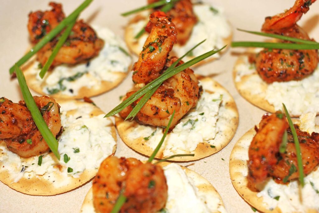 garlic shrimp canapé topped with chives