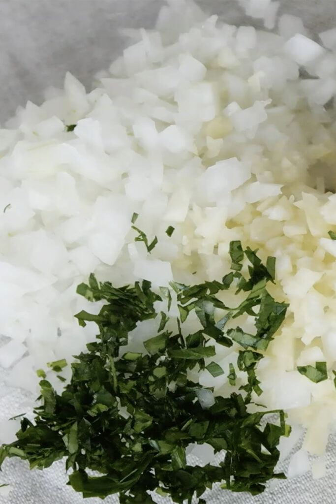 chopped ingredients. onion, minced garlic, chopped parsely