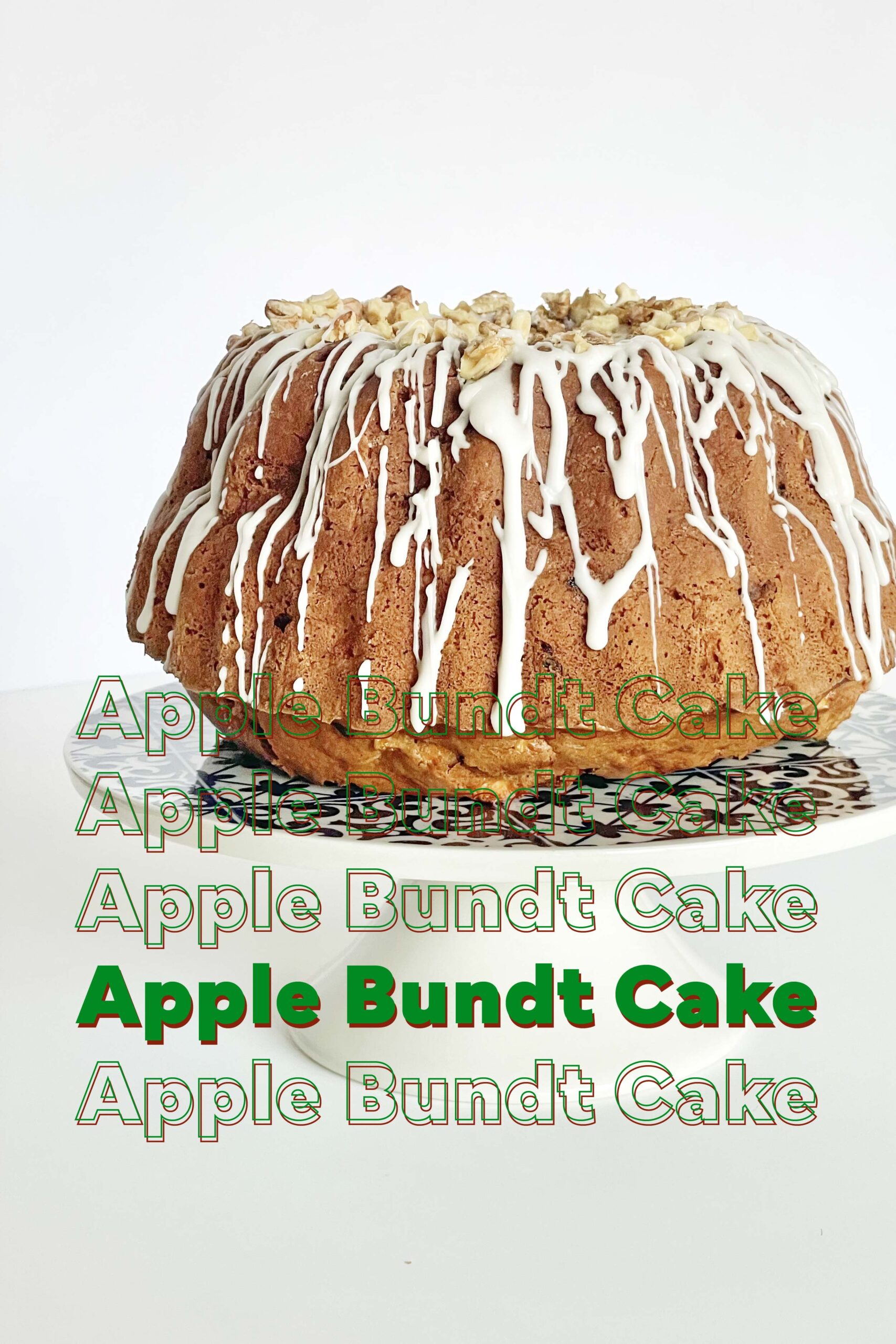 a whole apple bundt cake icing on the top with walnuts