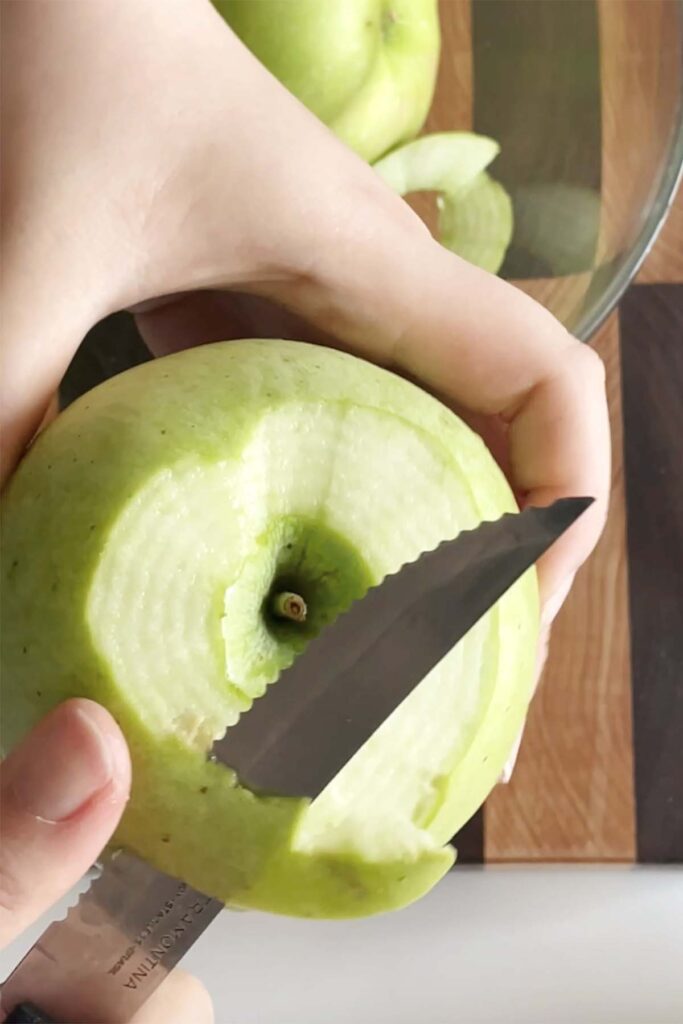 peeling a green apple