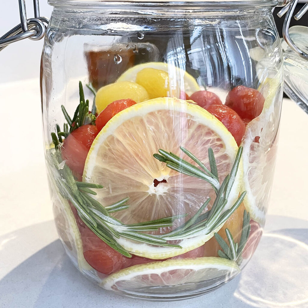 sliced lemon, cherry tomatoes, rosemary